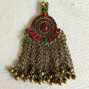 Rhinestone encrusted pendant with miniature bells hanging from brass chain links